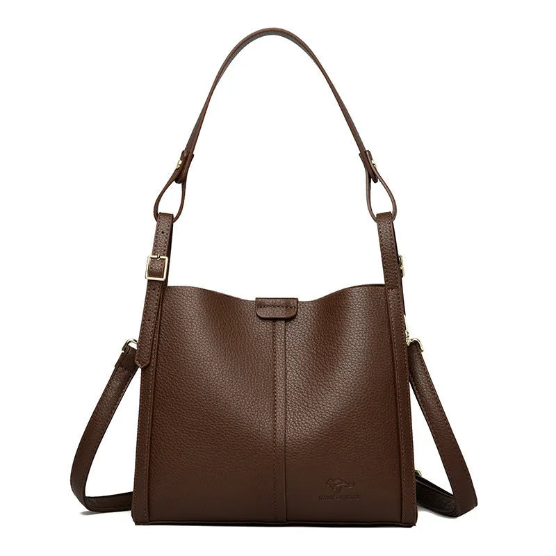 Brown retro ladies shoulder bag with zip compartments showing vertical square shape and single strap
