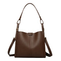 Brown retro ladies shoulder bag with zip compartments showing vertical square shape and single strap