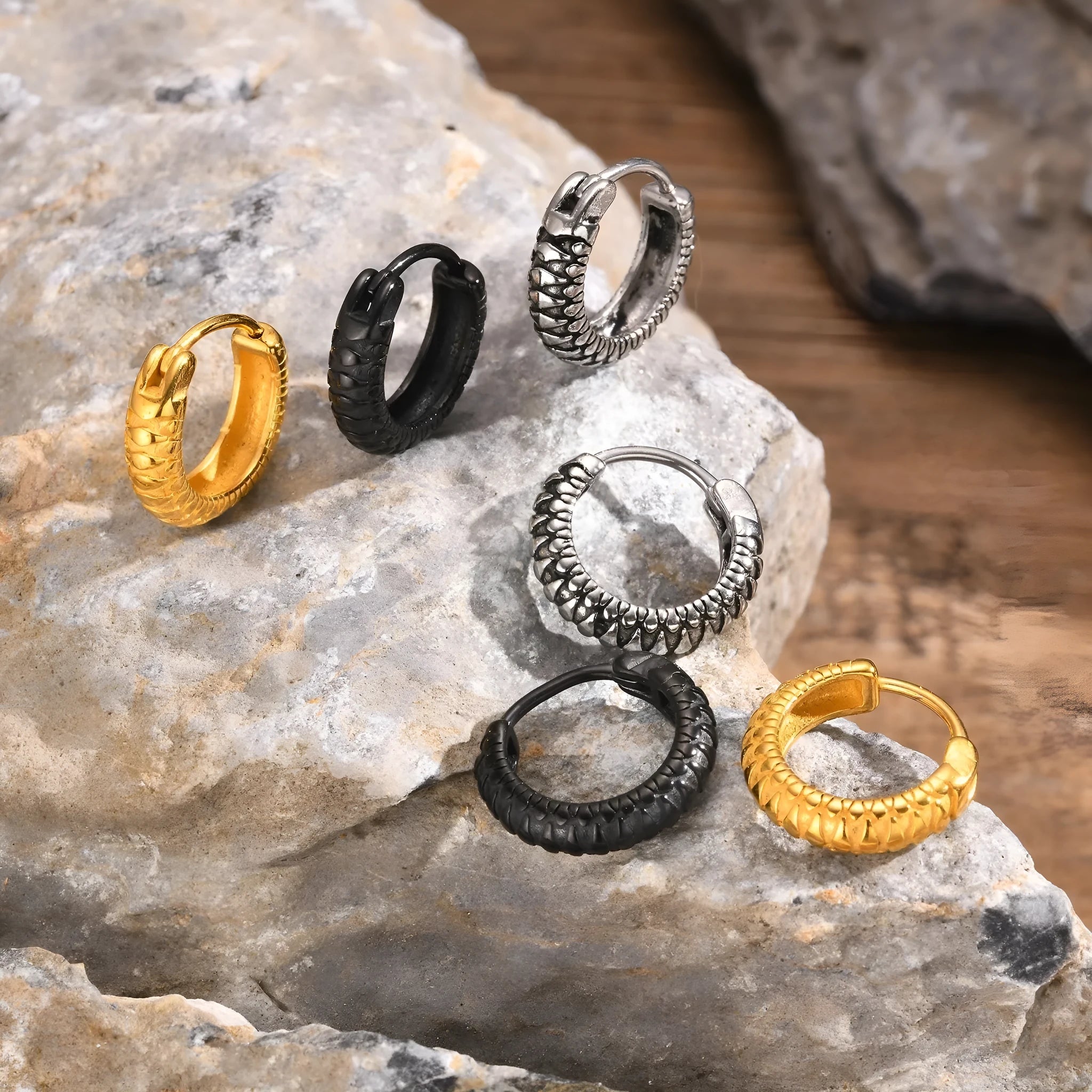 Stainless steel snake pattern earrings in black and gold finishes