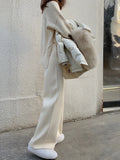 Women's thick knitted wide-leg winter trousers in straight-leg style with elastic high waist