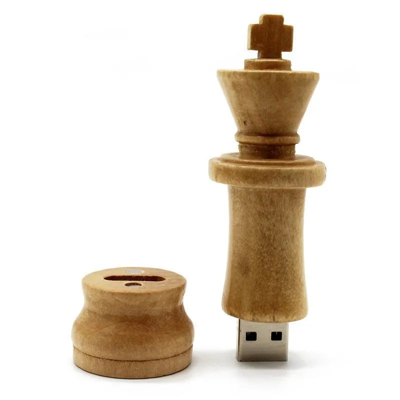 Wooden chess king USB flash drive in beige with USB 2.0 connector standing upright on a surface