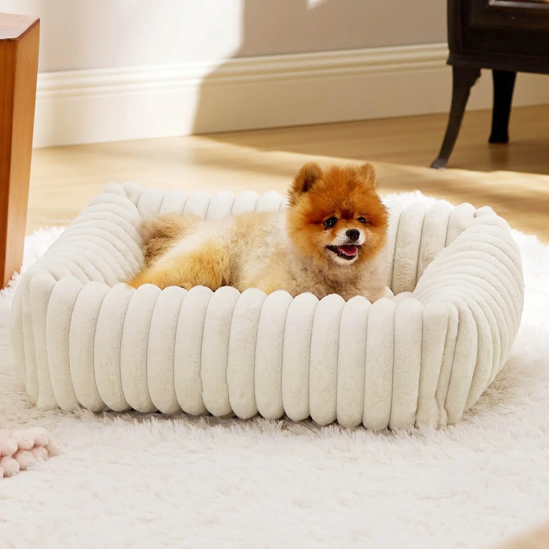 Rectangular orthopaedic dog bed with raised edges in beige colour showing high-density foam filling