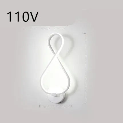 Minimalist Nordic design LED wall lamp with a silicone shade, mounted on a bedroom wall.