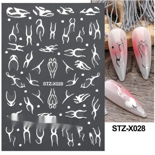 Black and silver stripe nail art sticker with a love pattern design on a plastic sheet.