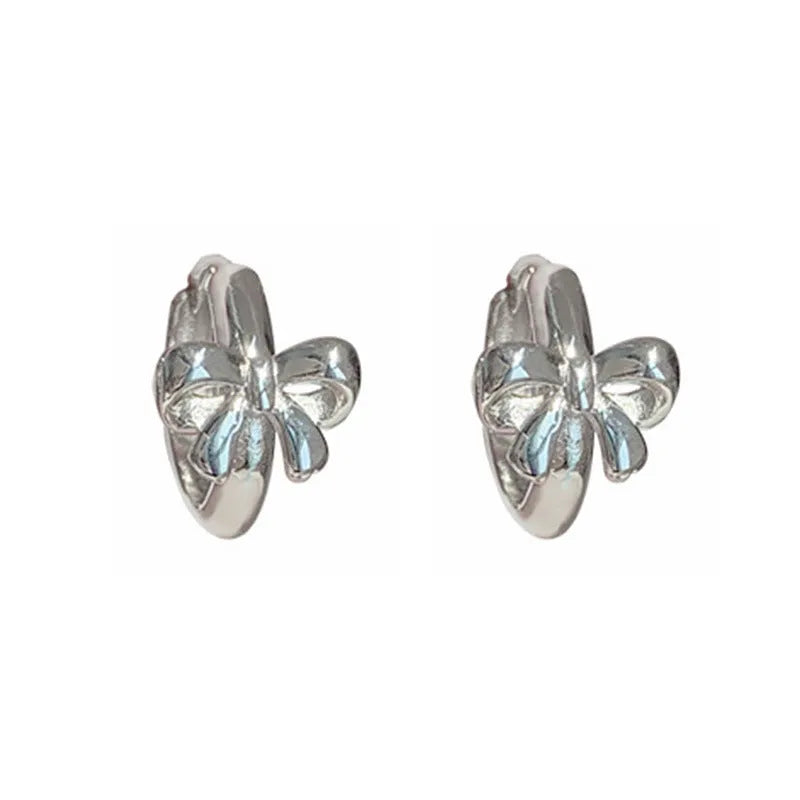 925 sterling silver bow earrings for women with silver electroplated finish on a white background