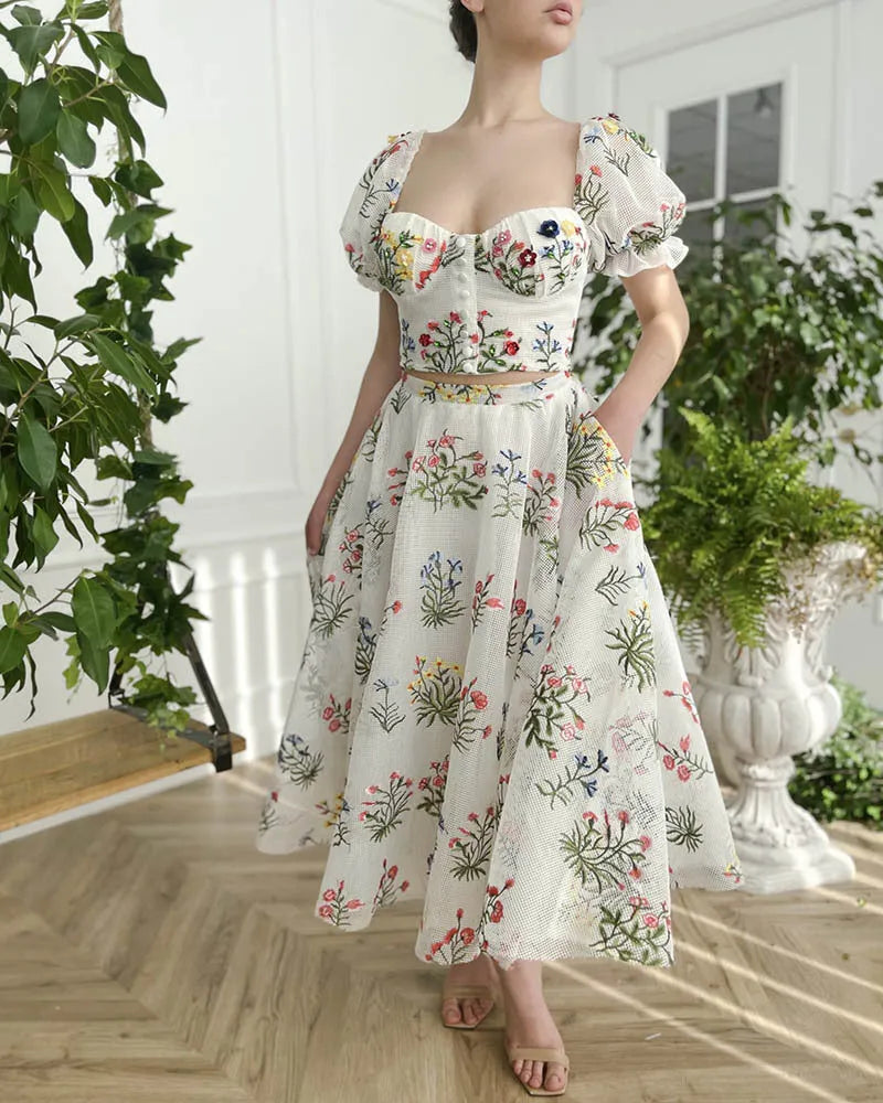 Women's fitted waist backless embroidered floral white two-piece set with mid-length skirt on white background