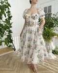 Women's fitted waist backless embroidered floral white two-piece set with mid-length skirt on white background