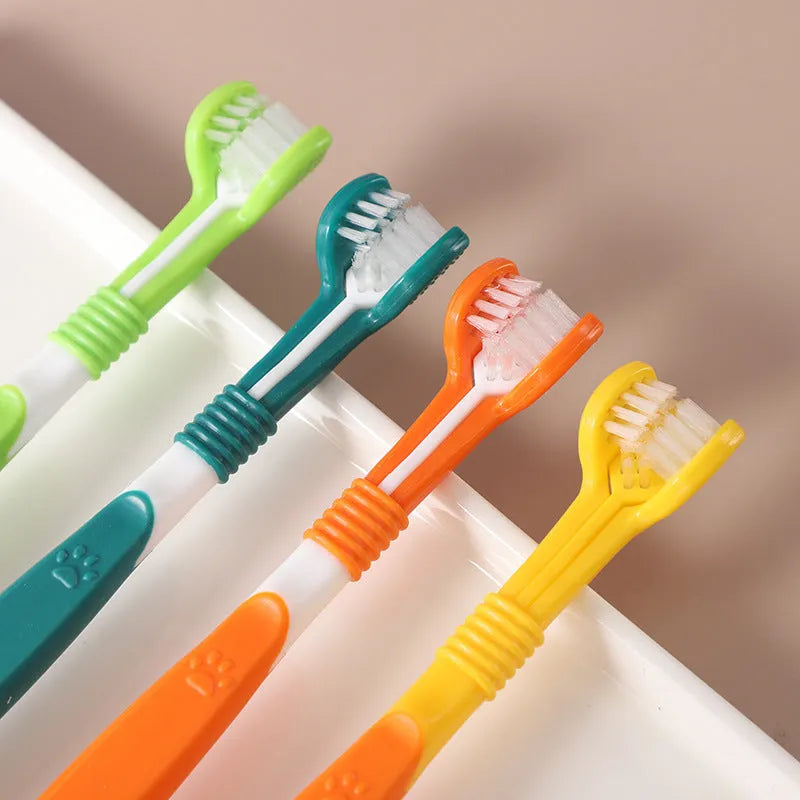 Pet toothbrush with nylon bristles and plastic handle in green colour