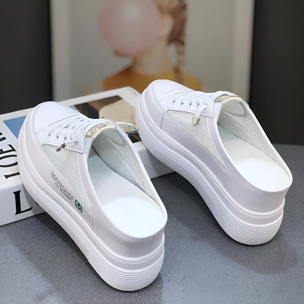 White women's mesh platform shoes with round toe and rubber sole.