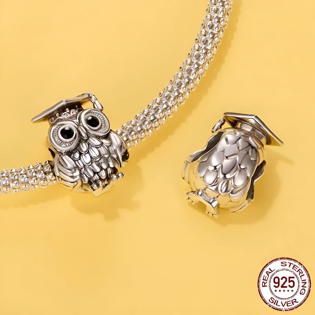 Silver S925 sterling silver owl bead with drip oil finish on white background