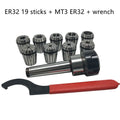 ER32 CNC milling tool set with collets, Morse taper arbor, and wrench on a workbench