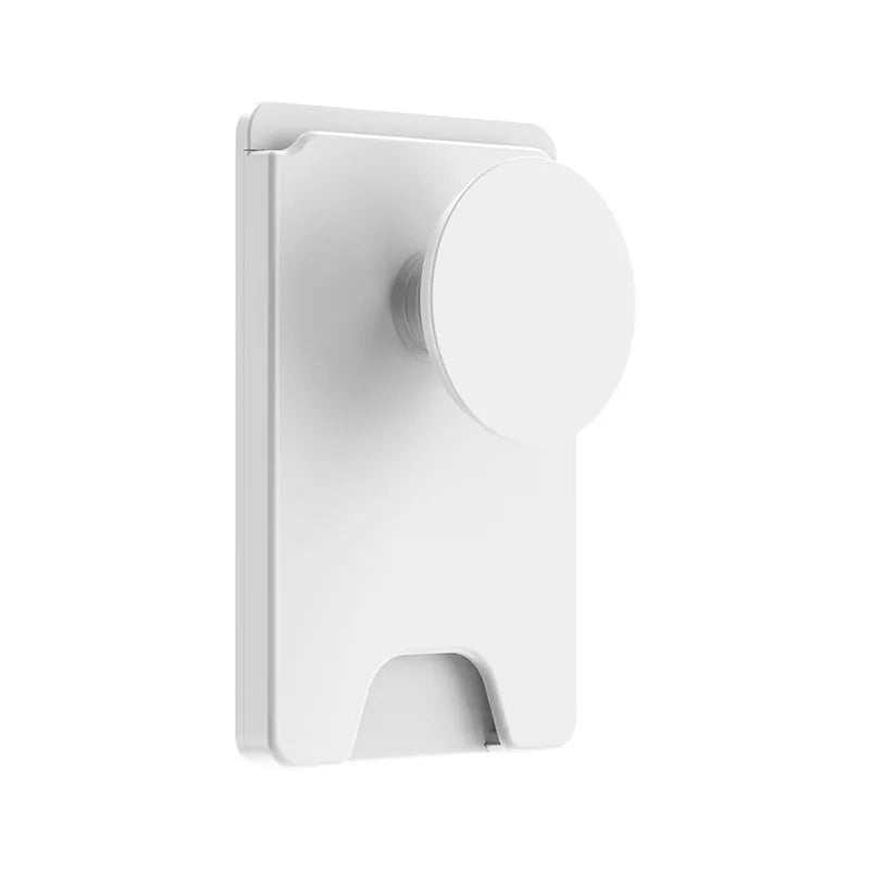 Minimalist black magnetic suction phone holder for iPhone on a desk.
