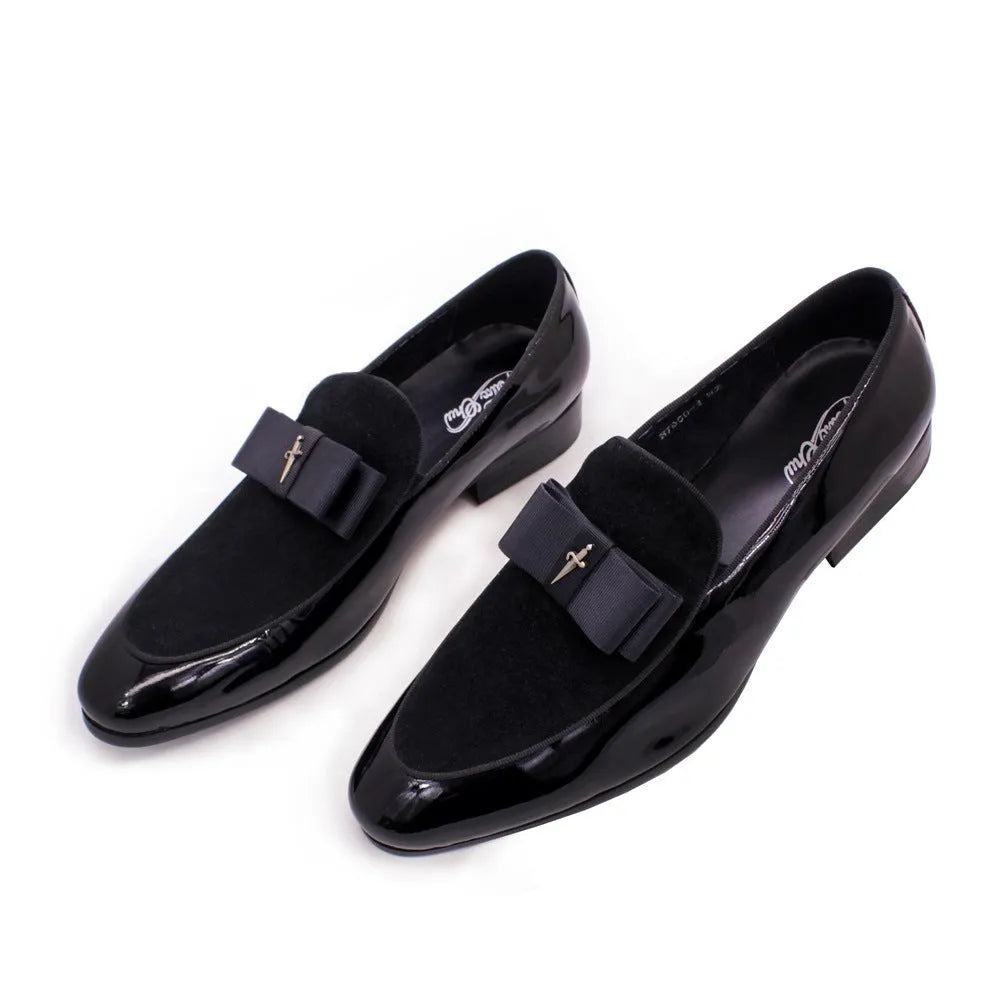 Men's glossy black patent leather low-top shoes with a tassel detail on a white background.