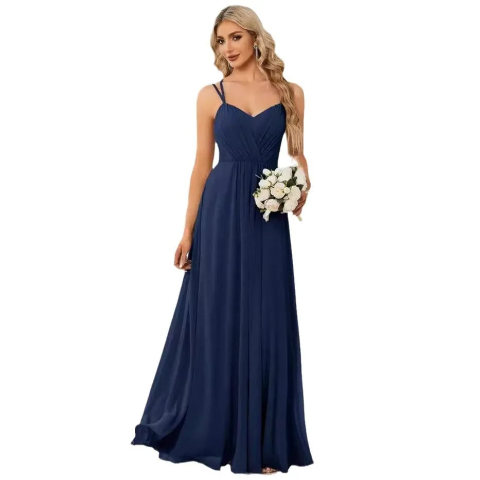 Women's sleeveless banquet dress with pleated A-line long skirt in light green, showing sling neckline.