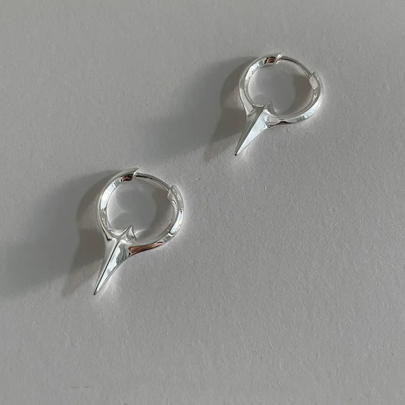 Geometric star stud earrings for women with white gold plated finish on copper.