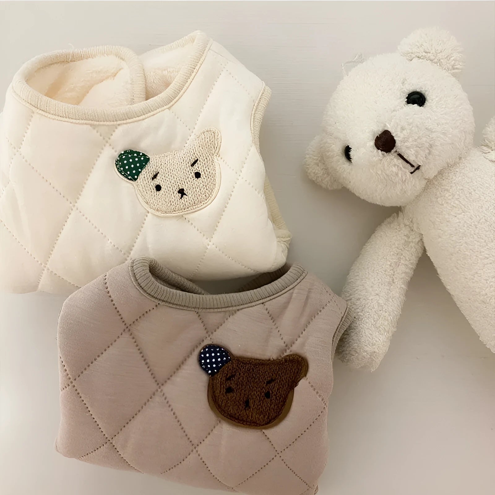 Quilted pet vest with embroidered bear patch and polka-dot ears, cream beige colour, for small dogs, side view
