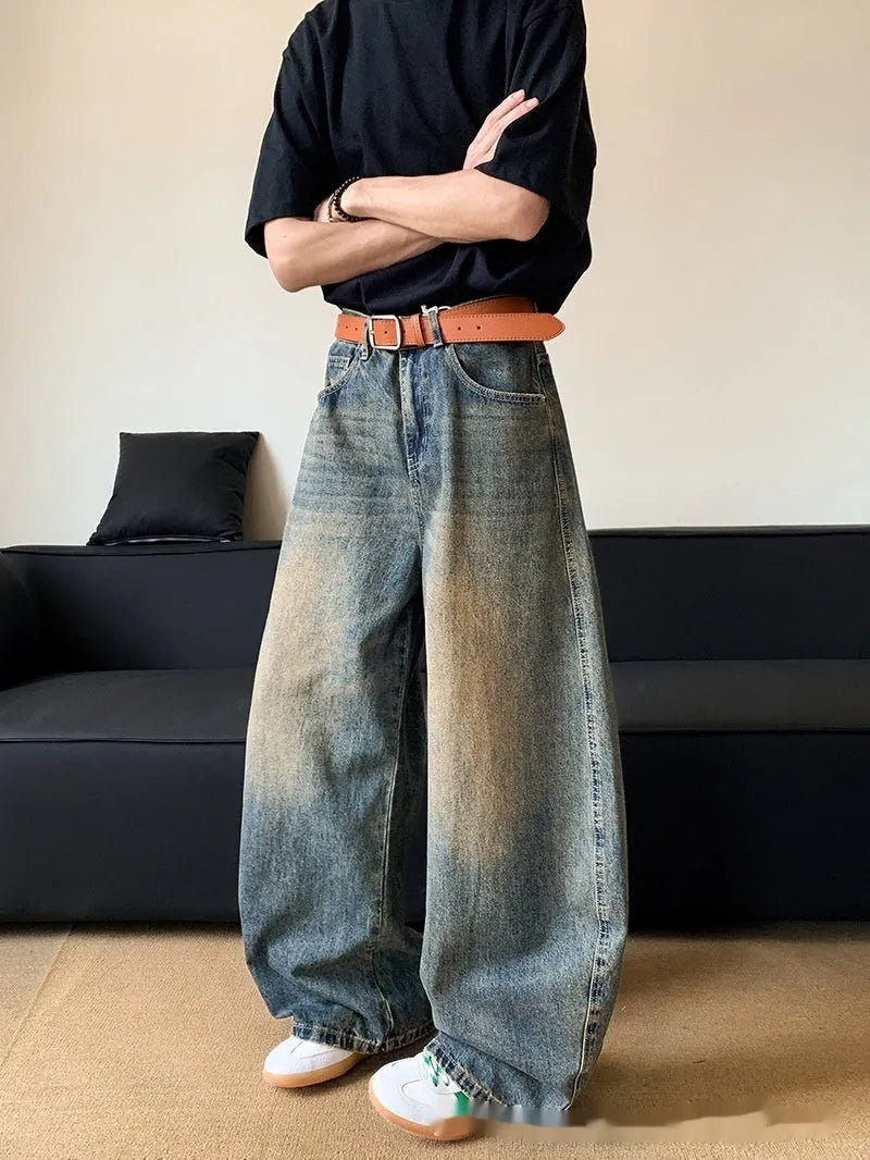 Men's retro blue distressed denim jeans with machete detailing and wide-leg fit