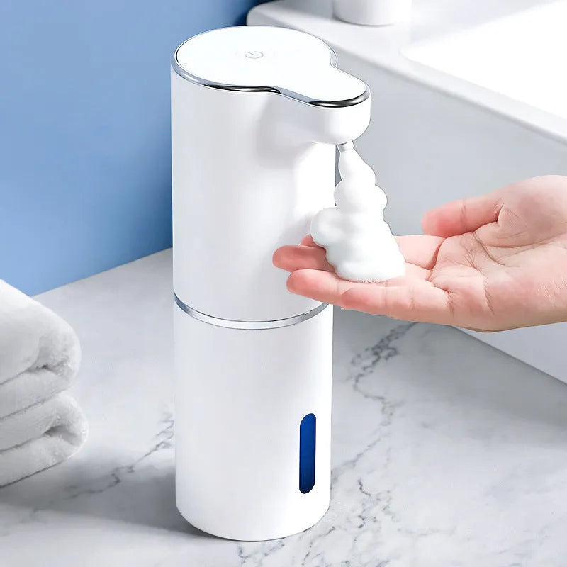 White automatic sensor soap dispenser with ABS body and USB cable on countertop