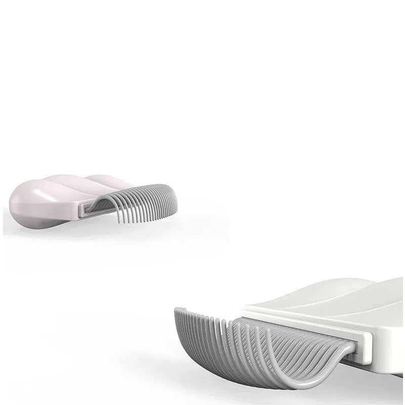 Blue Paw Soft deshedding brush for cats and dogs on a white surface.