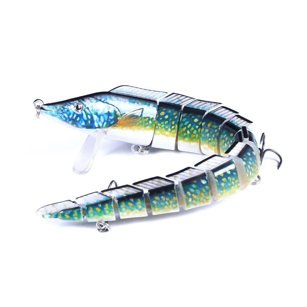 Multi-segment soft fishing lure mimicking a loach, shown in a realistic colour pattern with a visible hook.