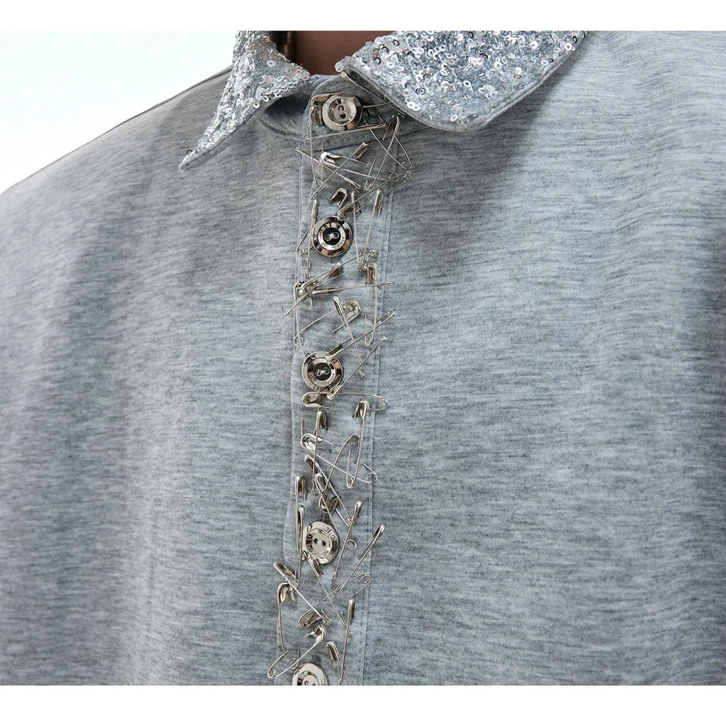 Loose fit black sequined shirt with square neckline and short sleeves on a model