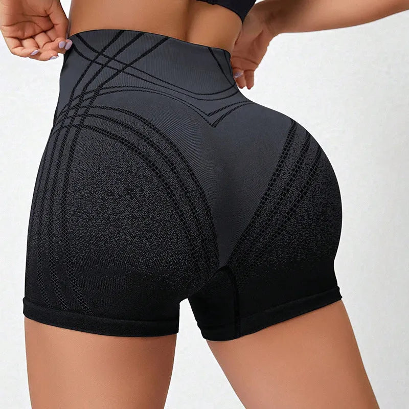 Women's high waisted gradient fitness shorts in black, shown for yoga or dance sport use.