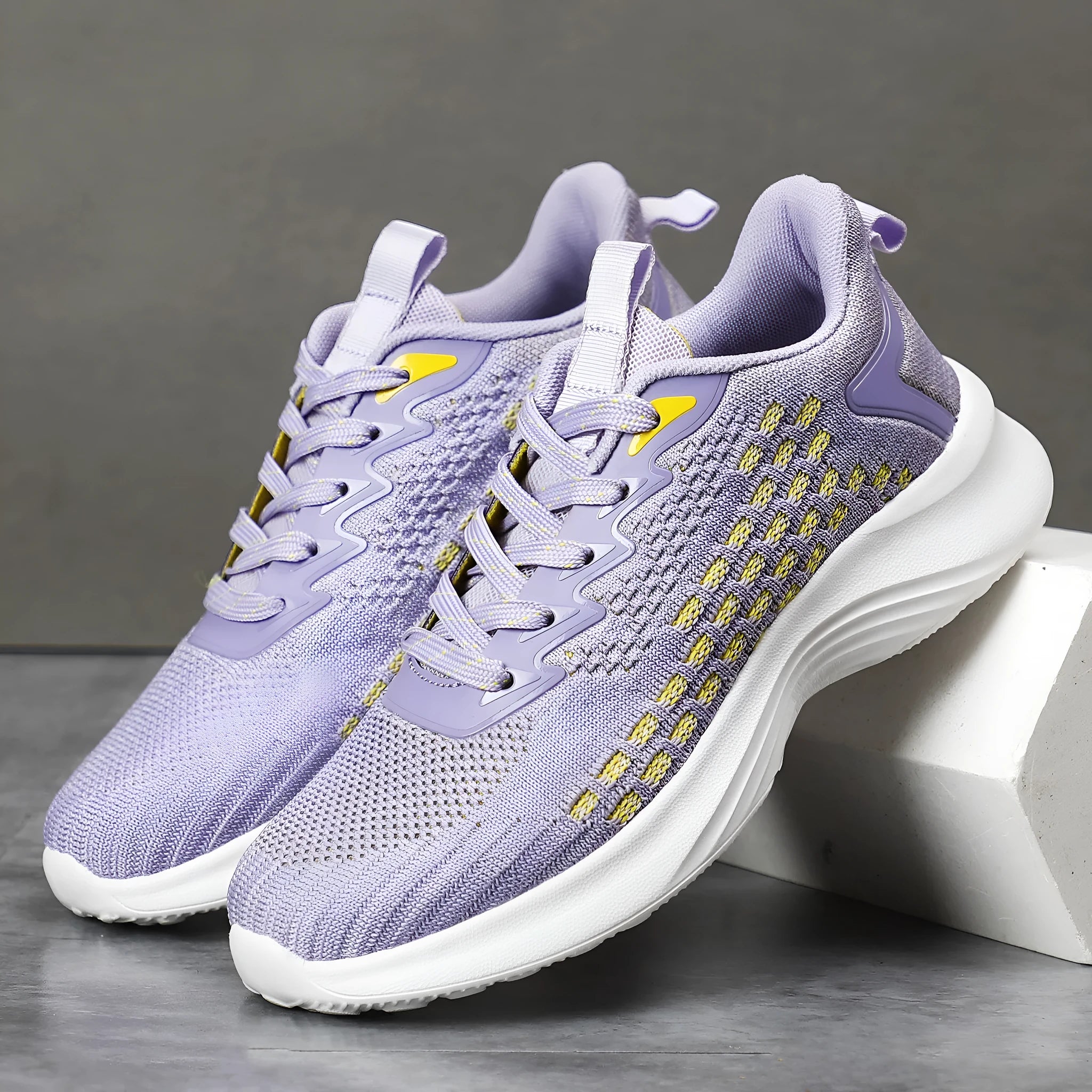Women's lavender purple Flyknit running shoes with mesh lining and striped pattern.