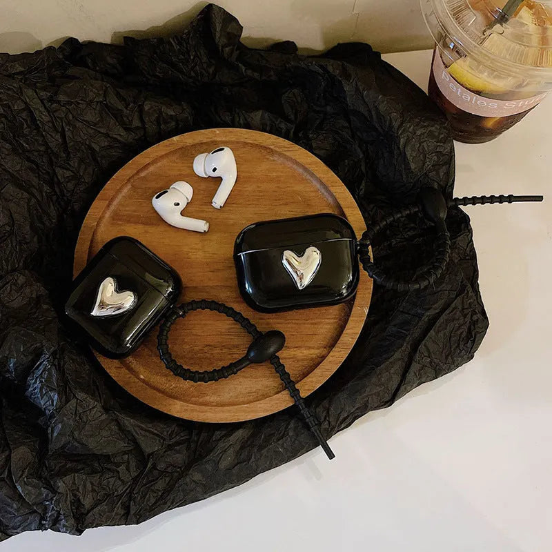 Black earphone sleeve with electroplated love heart design for AirPods case showing TPU back cover and black cord