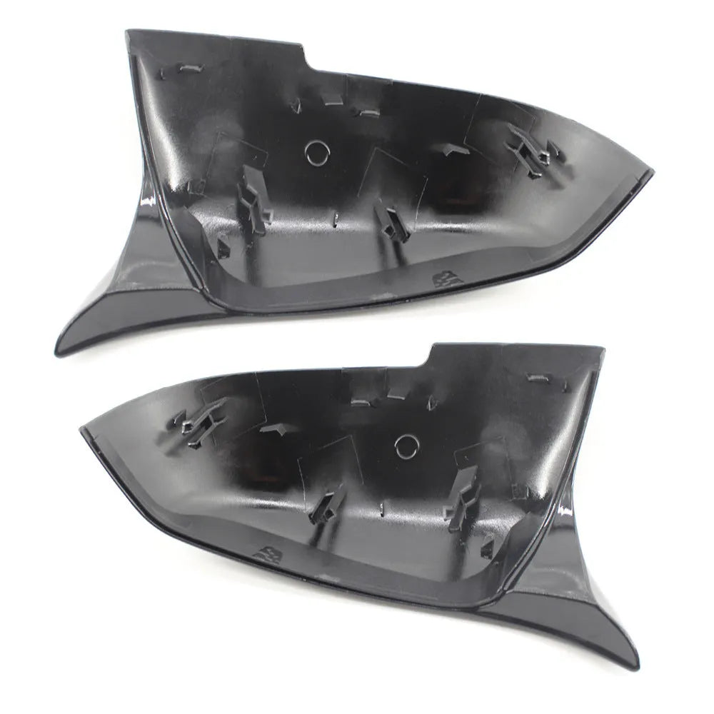 Pair of paint bright black BMW F-Series rear-view mirror replacement shells.