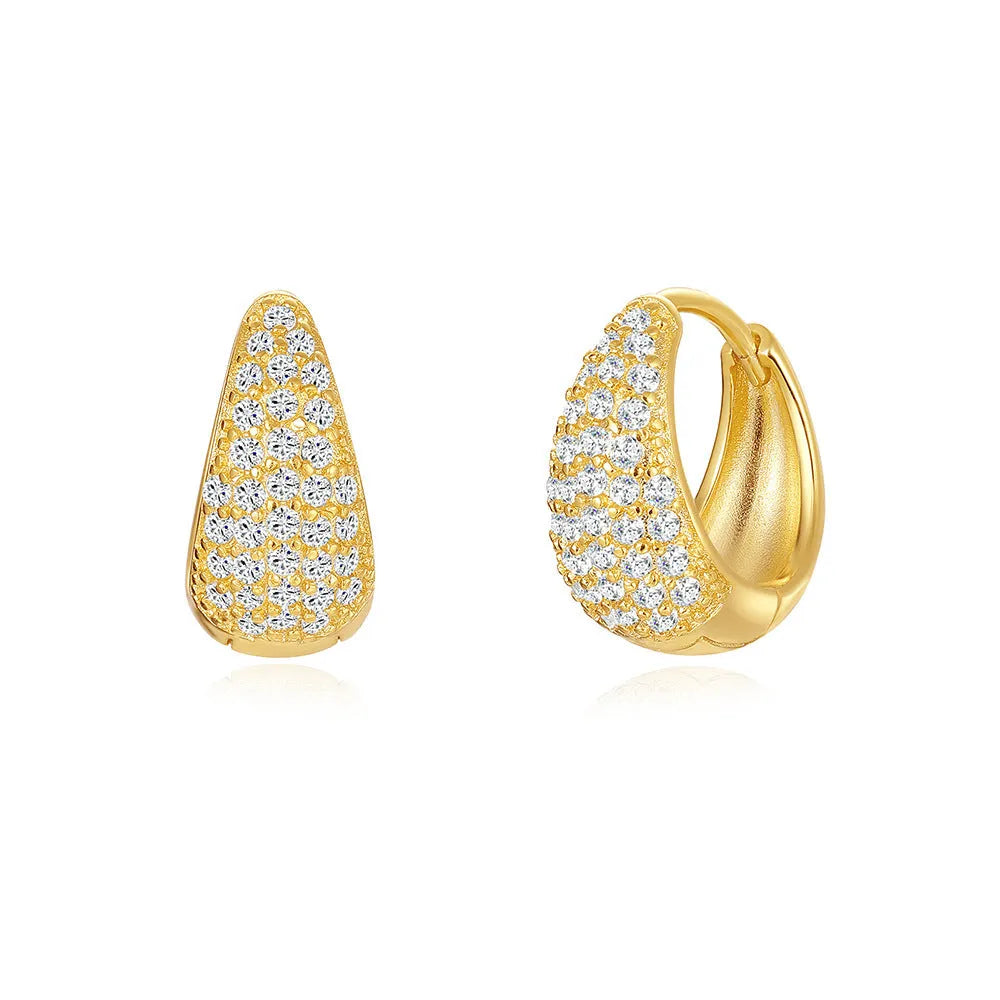 A pair of gold tone geometric earclip earrings with a round design and screw-back mechanism.