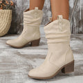 Women's suede mid heel boots in milky white colour with a calf-length design and rubber sole.