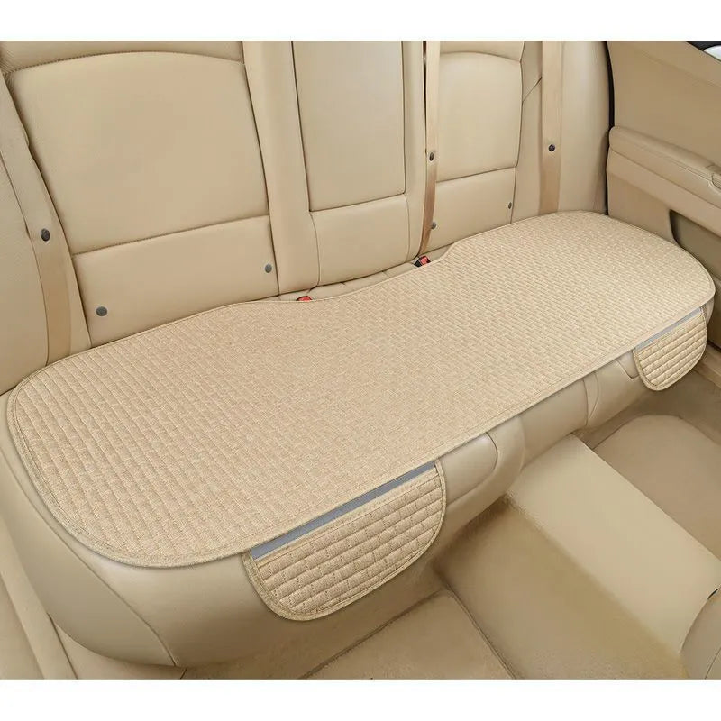 Linen car seat cushion with hemmed edge in charm coffee colour, shown on a car seat.