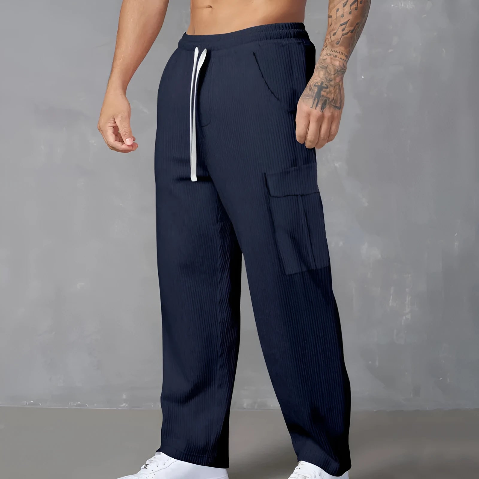 Men's loose-fitting corduroy cargo trousers in a straight-leg cut, shown in a solid colour.