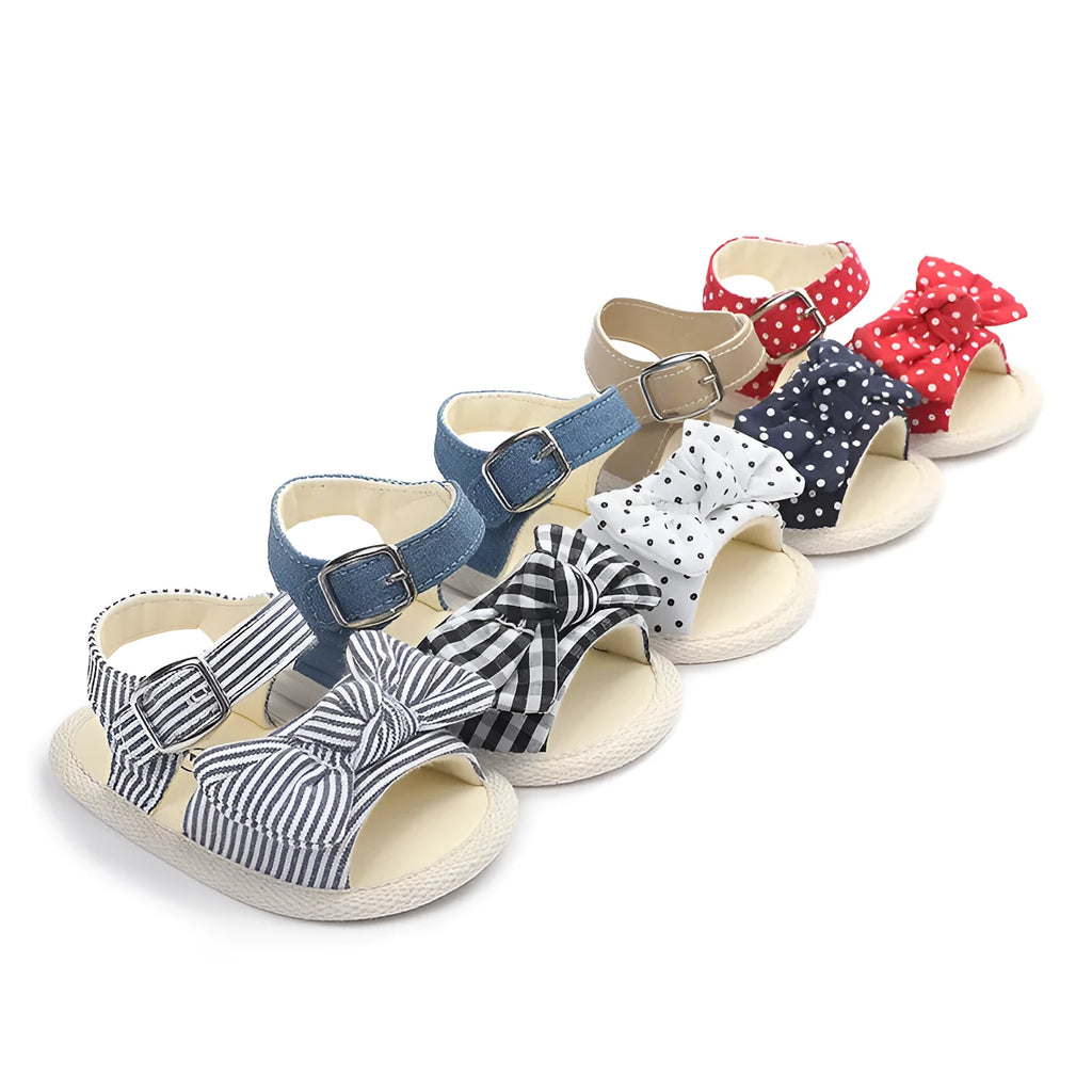 White and black low-tube Velcro baby shoes showing sizes 11cm, 12cm, and 13cm