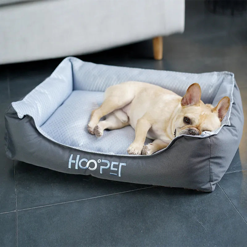 Soft grey dog bed with raised sides and a removable cover, shown in medium size.