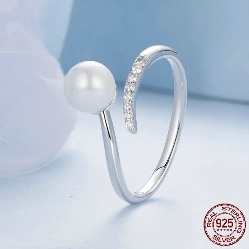 S925 sterling silver adjustable open loop ring with a natural shell pearl.