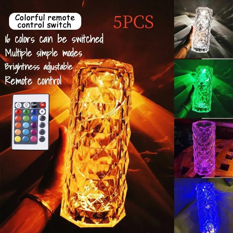 Modern acrylic rose LED table lamp with diamond base and touch control on wooden surface