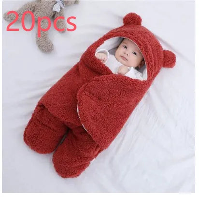 A baby quilted sleeping bag wrapper in a plain colour, showing its quilted pattern and soft cotton blend fabric.