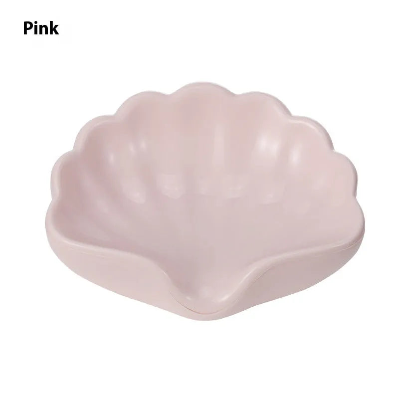 Shell-shaped plastic soap dish in pearl white or cherry blossom pink for bathroom storage