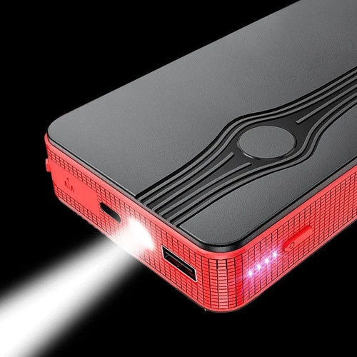 Red K4-E portable car jump starter and power bank with data cable, showing compact size for vehicle glovebox storage.