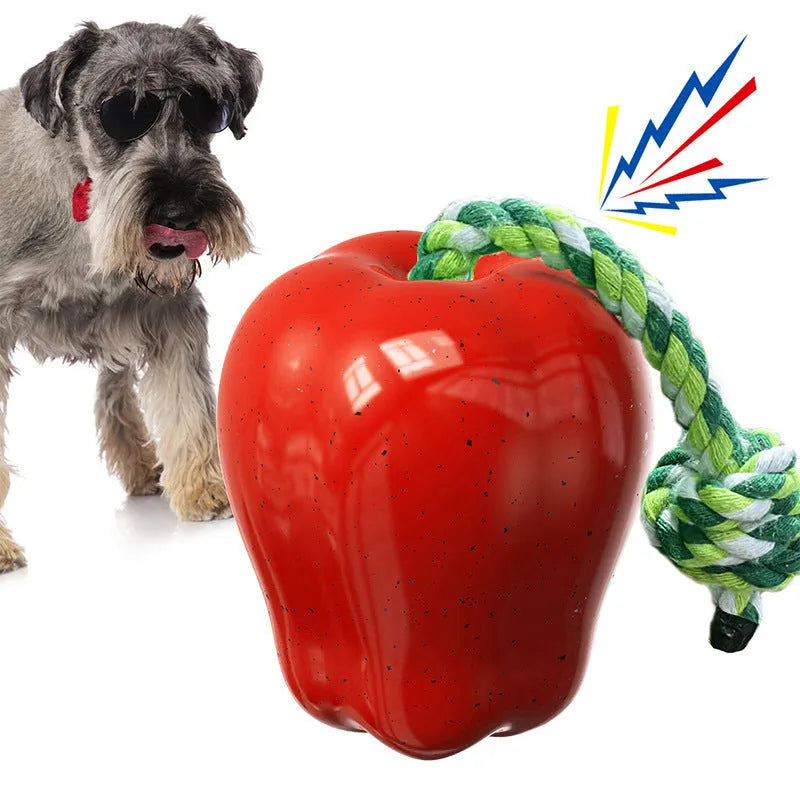 Green and red plastic dog toy shaped like a molar with a hollow centre for treat dispensing.