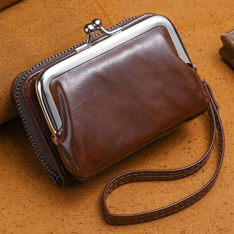 Ladies' leather-look coin purse with a 4-inch metal clip and zip closure in five colour options.