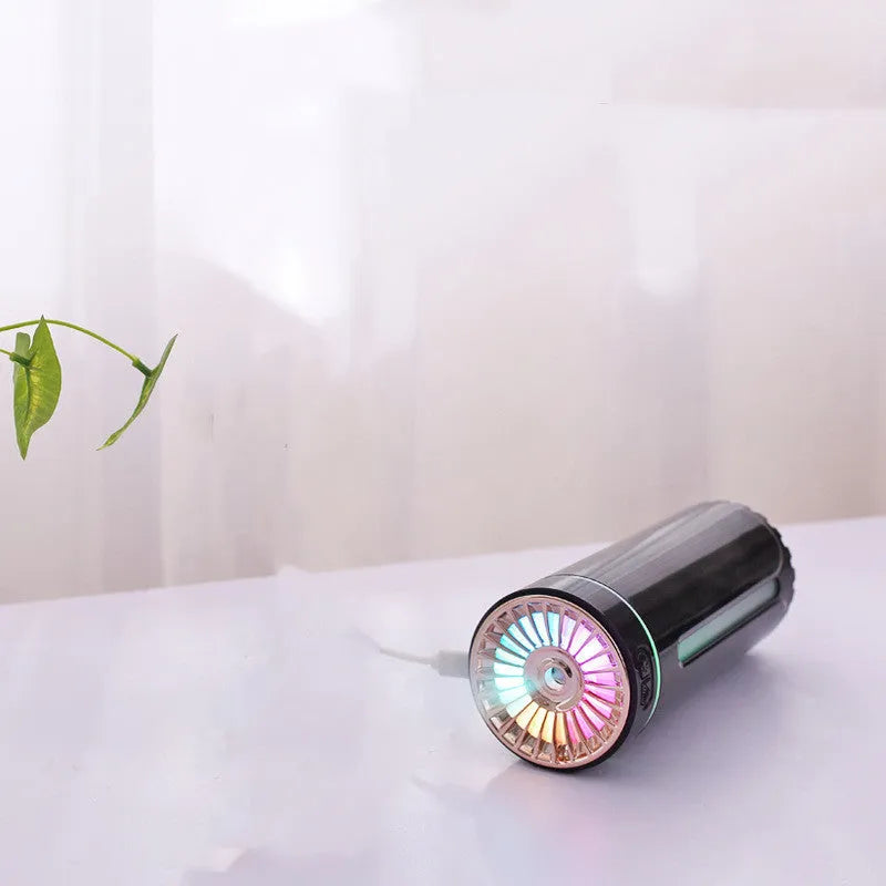 Portable black USB humidifier with colourful lights on car cup holder