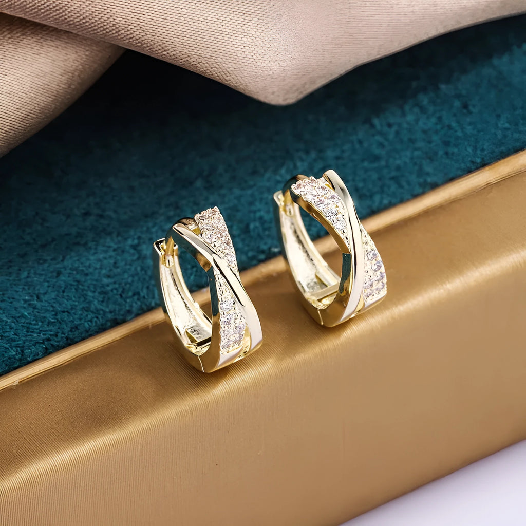 Geometric copper earrings with zircon treatment in 14K yellow colour, showing structured design and clean lines