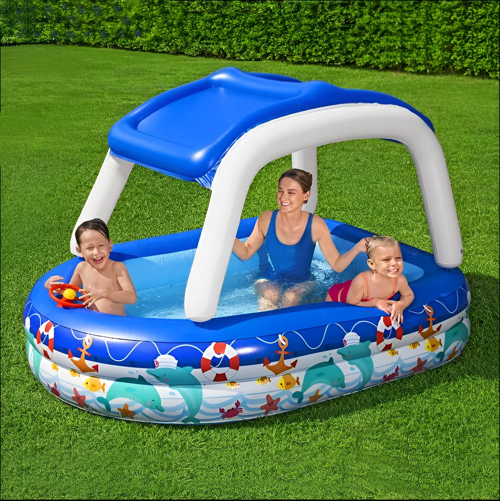 Boat type inflatable PVC sunshade paddling pool for children, 2.13m long, blue with yellow canopy, set up in garden