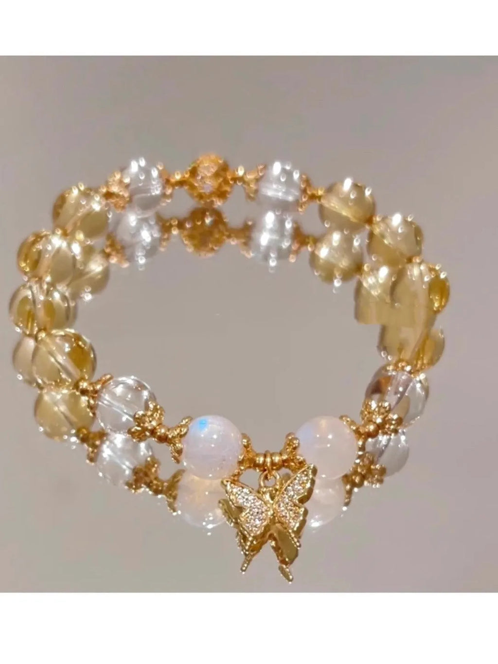 Moonstone white crystal bracelet with citrine butterfly motif and elastic closure