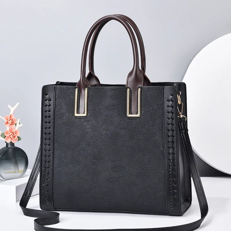 Ladies PU leather crossbody satchel bag with adjustable strap in black, horizontal square shape, soft finish