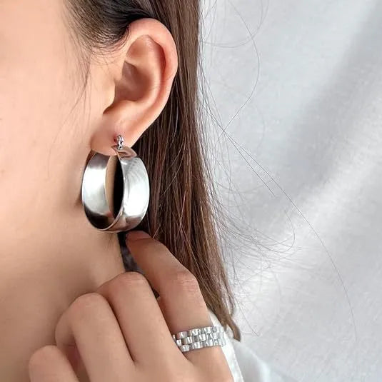 Stainless steel curved earrings with electroplated gold or steel finish in 25mm or 30mm sizes