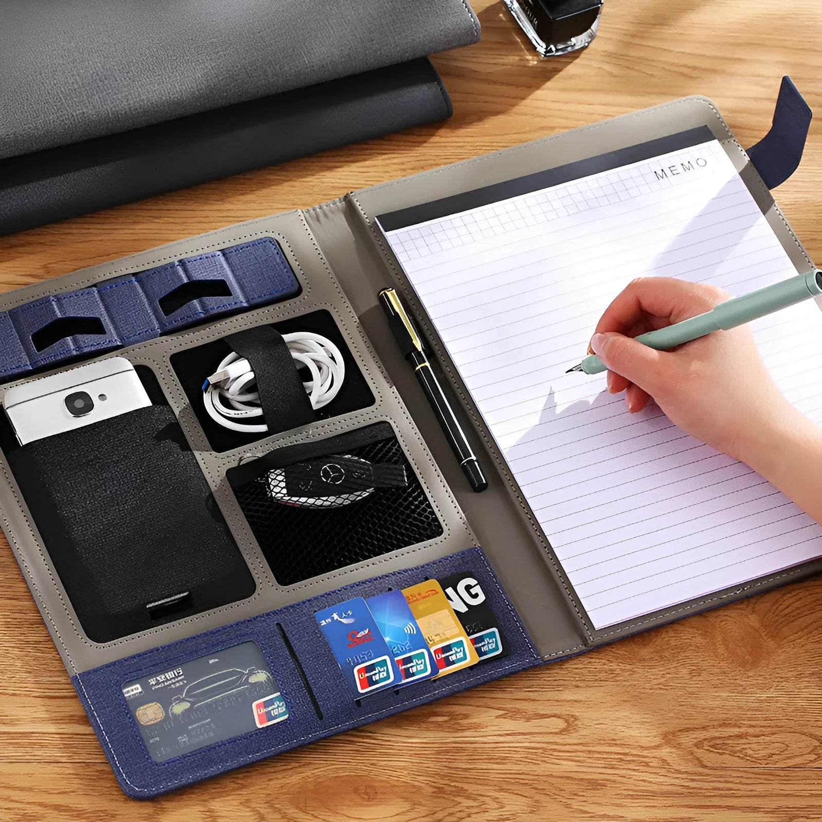 Leather A4 business folder in black, open to show 35mm thick plate and space for documents