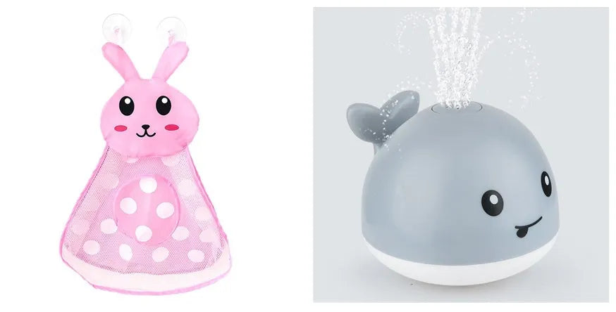 White and blue whale-shaped bath toy spraying water with LED lights on, floating in a baby bath